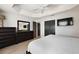 Comfortable bedroom featuring a ceiling fan and neutral paint, plenty of storage, and hardwood floors at 2947 Rain Lily Loop, The Villages, FL 32163