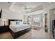 Main bedroom featuring trey ceilings, fan, and bench seating by windows offering great natural light at 2947 Rain Lily Loop, The Villages, FL 32163