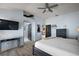 This main bedroom includes hardwood floors, a ceiling fan, and ample closet space at 2947 Rain Lily Loop, The Villages, FL 32163