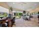 Combined dining and office area with bright natural light and easy access to the living room at 2947 Rain Lily Loop, The Villages, FL 32163