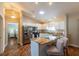 Bright and airy kitchen featuring white cabinets, stainless steel appliances, and a kitchen island with bar stool seating at 314 Olanta Dr, The Villages, FL 32162