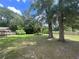 Expansive backyard with mature trees and a well-maintained lawn, great for outdoor activities at 3309 Ne 16Th Ave, Ocala, FL 34479