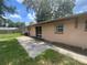 Wide backyard with a concrete patio and sliding glass door that provides seamless indoor-outdoor living at 3309 Ne 16Th Ave, Ocala, FL 34479