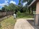 Exterior view of an expansive backyard with mature trees, well-maintained lawn, and privacy fence at 3309 Ne 16Th Ave, Ocala, FL 34479