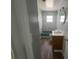 Bathroom with shower, vanity, and wood-look flooring at 3309 Ne 16Th Ave, Ocala, FL 34479