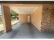 Covered carport with ample space for parking, featuring a brick accent wall at 3309 Ne 16Th Ave, Ocala, FL 34479