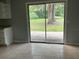 Dining area with tile flooring and a large sliding glass door leading to the outdoors at 3309 Ne 16Th Ave, Ocala, FL 34479