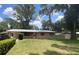 Charming single-story home with a well-maintained lawn and mature trees, offering great curb appeal at 3309 Ne 16Th Ave, Ocala, FL 34479