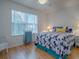Cozy bedroom with large window, ceiling fan, and natural light enhances the comfortable living space at 3337 Ashbrook Pl, The Villages, FL 32162