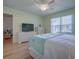Bright, cozy bedroom with hardwood floors with an open layout into the living spaces at 3337 Ashbrook Pl, The Villages, FL 32162
