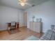 Bright bedroom featuring a desk, laminate flooring, and a window with natural light at 3337 Ashbrook Pl, The Villages, FL 32162