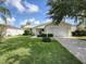 Charming single-story home with a well-manicured lawn and an attached two-car garage at 3337 Ashbrook Pl, The Villages, FL 32162