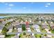 Stunning aerial view showcases the property's location within a peaceful community near a lake at 3373 Melbourne Ln, The Villages, FL 32163