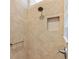 Bathroom shower with tiled walls, showerhead and built-in alcove at 3373 Melbourne Ln, The Villages, FL 32163