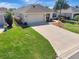 Well-maintained single-story home with a two-car garage and a spacious driveway at 3405 Rabbit Run Path, The Villages, FL 32163