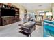 Bright living space with an entertainment center and comfortable seating area at 3405 Rabbit Run Path, The Villages, FL 32163