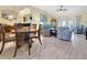 Spacious living room with wood-look tile flooring and an open layout perfect for entertaining at 3405 Rabbit Run Path, The Villages, FL 32163