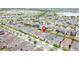 From above, a neighborhood features similar roof lines, landscaping, and community planning at 345 Alcove Dr, Groveland, FL 34736