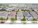 A beautiful neighborhood is shown from above, with manicured lawns and similar home elevations at 345 Alcove Dr, Groveland, FL 34736