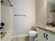 A clean bathroom with a toilet, granite countertop vanity, and a shower and bath tub at 345 Alcove Dr, Groveland, FL 34736