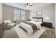 Stylishly furnished bedroom with a ceiling fan, natural light, and a cozy ambiance at 345 Alcove Dr, Groveland, FL 34736