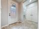 Bright entryway featuring tile flooring and a decorative glass front door at 345 Alcove Dr, Groveland, FL 34736