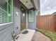 Charming front entrance with decorative glass door, turtle decor, and brown siding at 345 Alcove Dr, Groveland, FL 34736