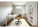 Cozy office space featuring natural light, a modern desk, and a stylish bookcase at 345 Alcove Dr, Groveland, FL 34736