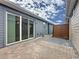 Beautiful outdoor patio with glass sliding door, rock garden, and privacy fence creates a relaxing atmosphere at 345 Alcove Dr, Groveland, FL 34736