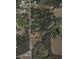 Expansive aerial view of a wooded property with ponds and roadways, offering privacy and natural surroundings at 36126 Cr 439, Eustis, FL 32726