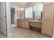 The bathroom features double sinks, tiled flooring, and updated lighting at 36845 Taylor Mill Rd, Fruitland Park, FL 34731