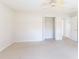 Bedroom with open closet and views to additional rooms at 36845 Taylor Mill Rd, Fruitland Park, FL 34731