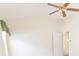 An empty bedroom with a ceiling fan and neutral colored walls at 36845 Taylor Mill Rd, Fruitland Park, FL 34731