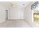 Light and airy bedroom with white walls, carpet, and a ceiling fan at 36845 Taylor Mill Rd, Fruitland Park, FL 34731