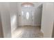 The home features a bright foyer with decorative tile flooring and a glass front door at 36845 Taylor Mill Rd, Fruitland Park, FL 34731