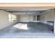 View of the 2-car garage showing the ample space, window, and door to interior at 36845 Taylor Mill Rd, Fruitland Park, FL 34731