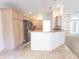 Kitchen with natural cabinets, stainless steel appliances and breakfast bar at 36845 Taylor Mill Rd, Fruitland Park, FL 34731
