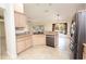Kitchen featuring stainless steel appliances, breakfast bar, and natural light at 36845 Taylor Mill Rd, Fruitland Park, FL 34731