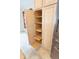 A large kitchen pantry with roll out shelves for easy storage and organization at 36845 Taylor Mill Rd, Fruitland Park, FL 34731