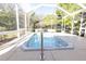 Spacious screened lanai featuring a jacuzzi tub for outdoor relaxation at 36845 Taylor Mill Rd, Fruitland Park, FL 34731