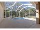 View of the screened in lanai with jacuzzi tub and outdoor living at 36845 Taylor Mill Rd, Fruitland Park, FL 34731