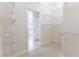 Spacious walk-in closet with carpet and shelving. Doorway leads to bathroom at 36845 Taylor Mill Rd, Fruitland Park, FL 34731