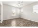 Bedroom featuring tile floors, ceiling fan, and bright windows at 37031 Lake Overlook Dr, Grand Island, FL 32735