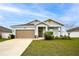 Charming single-Gathering home with a well-manicured lawn and a two-car garage, perfect for suburban living at 37031 Lake Overlook Dr, Grand Island, FL 32735