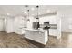 Bright kitchen with granite countertops, stainless steel appliances, and wood-style tile floors at 37031 Lake Overlook Dr, Grand Island, FL 32735