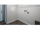 Laundry room with hookups, tiled flooring and white walls at 37031 Lake Overlook Dr, Grand Island, FL 32735