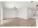 Open living room with tile floors, ceiling fan, and bright natural light at 37031 Lake Overlook Dr, Grand Island, FL 32735