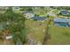 Aerial view of the house showing the large backyard with fire pit at 3900 Sw 102Nd Pl, Ocala, FL 34476