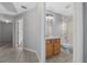 Bathroom with a tub and shower combo, wooden cabinets, and tiled flooring at 3900 Sw 102Nd Pl, Ocala, FL 34476