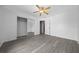 This spacious bedroom features sleek, modern flooring and a mirrored closet at 3900 Sw 102Nd Pl, Ocala, FL 34476